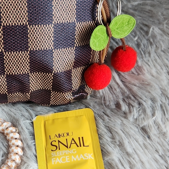 Checkered Cosmetic Pouch with Hair Accessories & Snail Mask - Picture 7 of 7